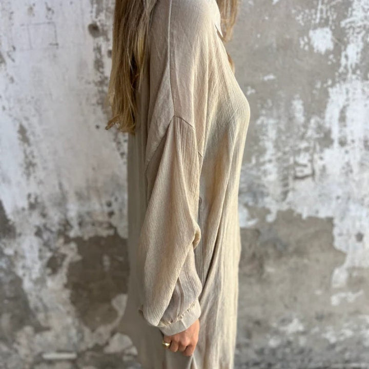Funa button-up shirt and pants set in black, styled for an evening look with heeled sandals