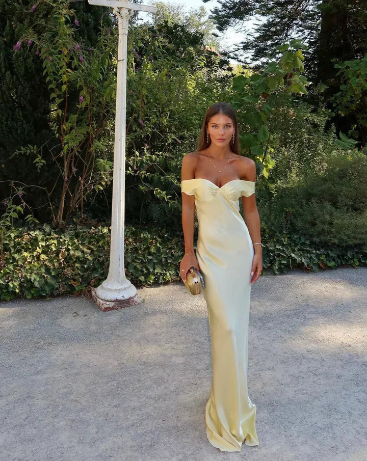 Front view of the Gabrielle gold satin gown showing the elegant off-shoulder neckline
