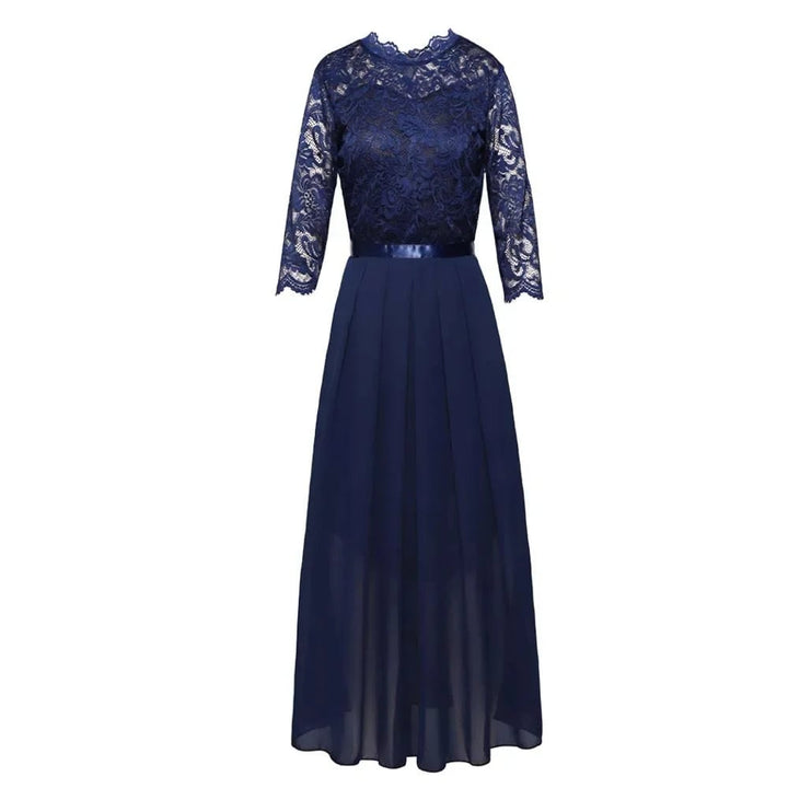 Close-up of delicate lace overlay bodice on a formal maxi dress in green