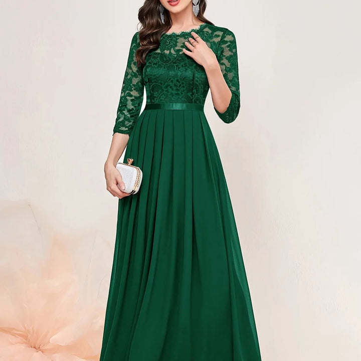 Front view of green quarter-sleeve lace maxi dress showing fitted bodice and flowing skirt