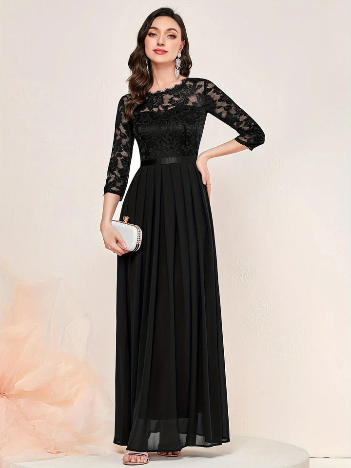 Model wearing red lace maxi dress paired with heeled sandals for a wedding guest look