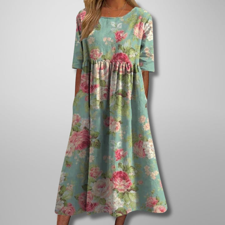 Front view of the floral midi dress showing the flowing silhouette and feminine print