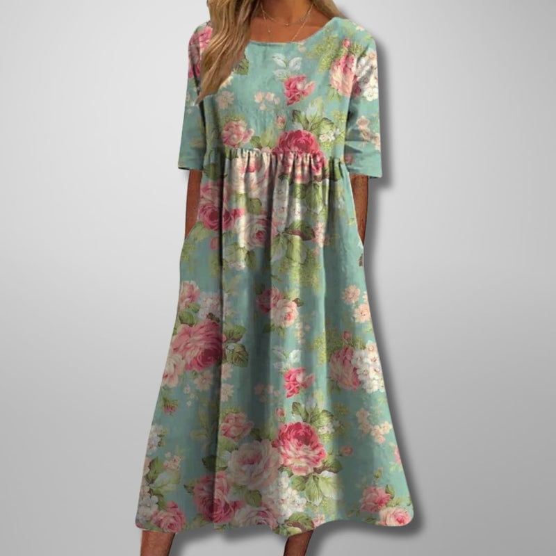 Front view of the floral midi dress showing the flowing silhouette and feminine print