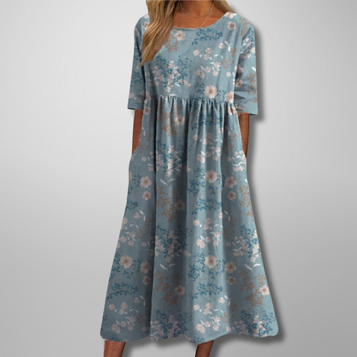Side view of the floral midi dress showing the flattering relaxed drape and midi length