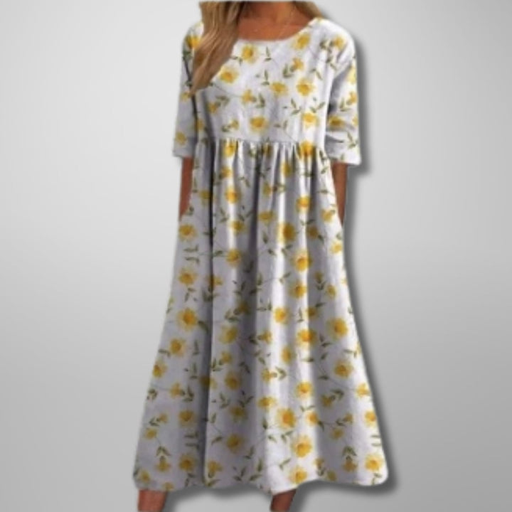 Back view of the relaxed floral midi dress showing the clean, elegant cut