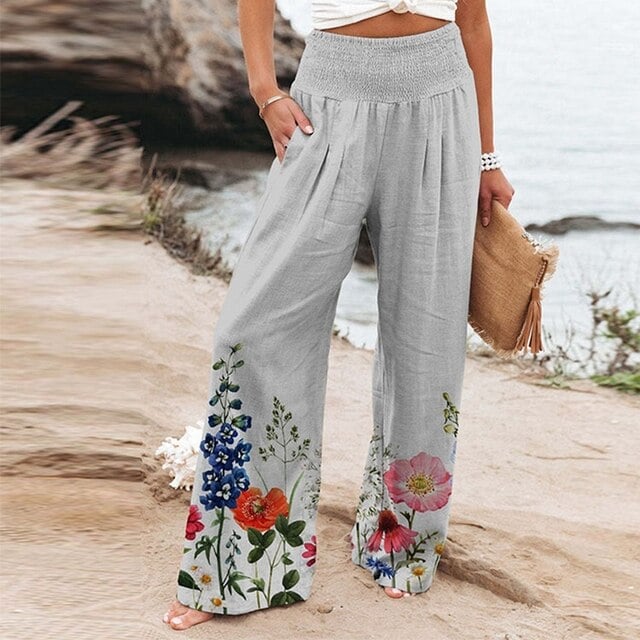 Women's floral wide-leg pants in multicolor botanical print with elasticated high waist, front view