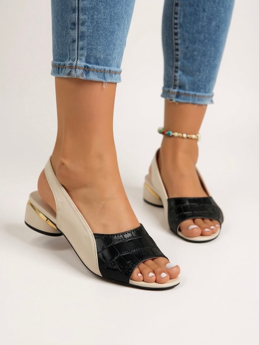 Side view of Garnet slingback sandals showing adjustable strap detail in brown