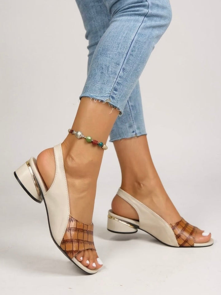 Garnet slingback sandals in red styled with a flowy dress for a casual occasion