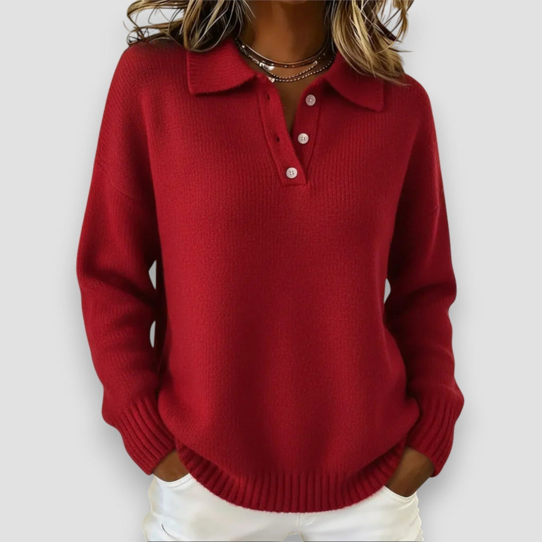 Woman wearing a blue polo sweater paired with jeans, casual weekend outfit, smiling front-facing pose