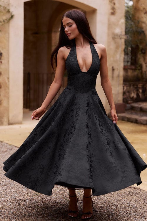 Full-length view of a wine red V-neck halterneck jacquard maxi dress with a flared skirt