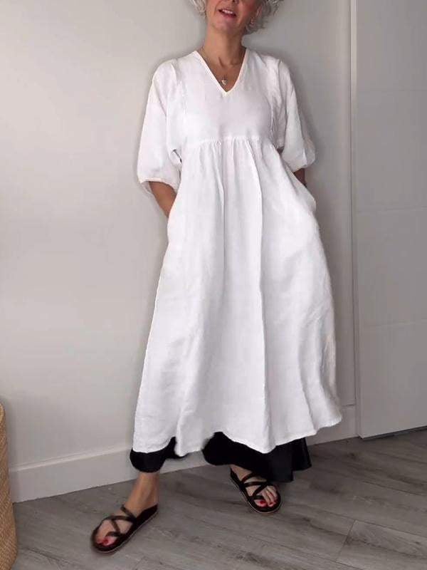 Back view of the Genevieve white draped midi dress showing the relaxed fit