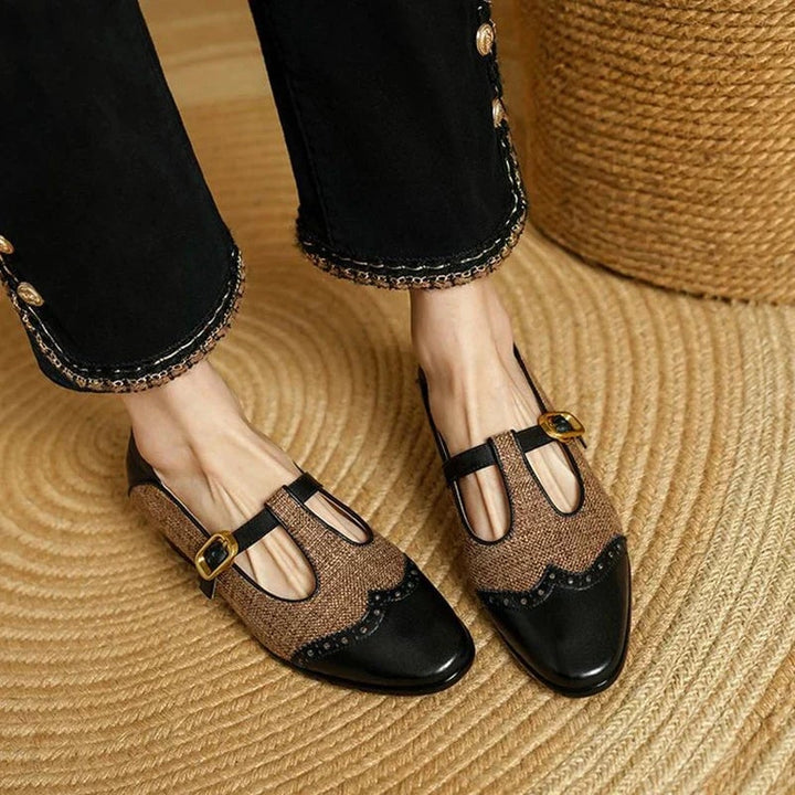 Cosima two-tone T-strap Mary Jane shoes in black and brown with low block heel, front view