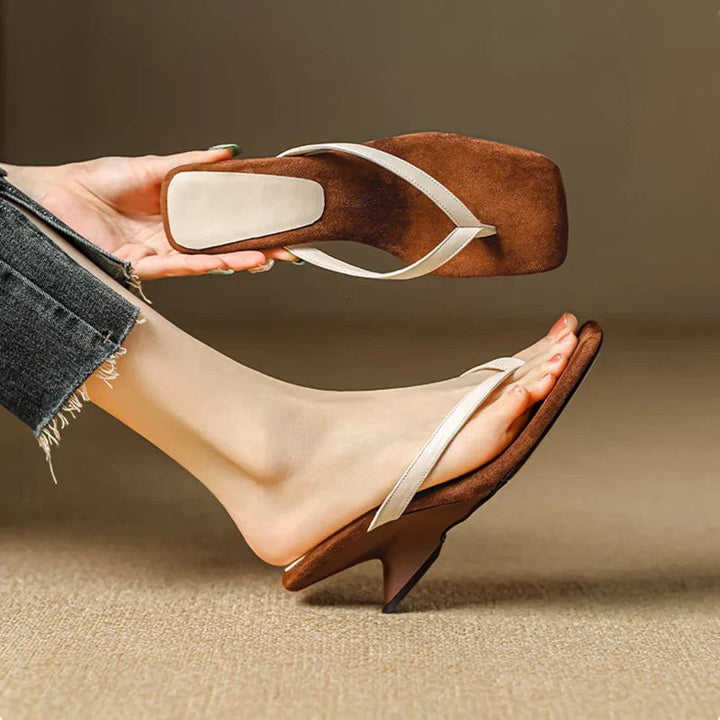 Georgette women's wedge sandal in black, showcasing the wedge heel and minimalist strap design