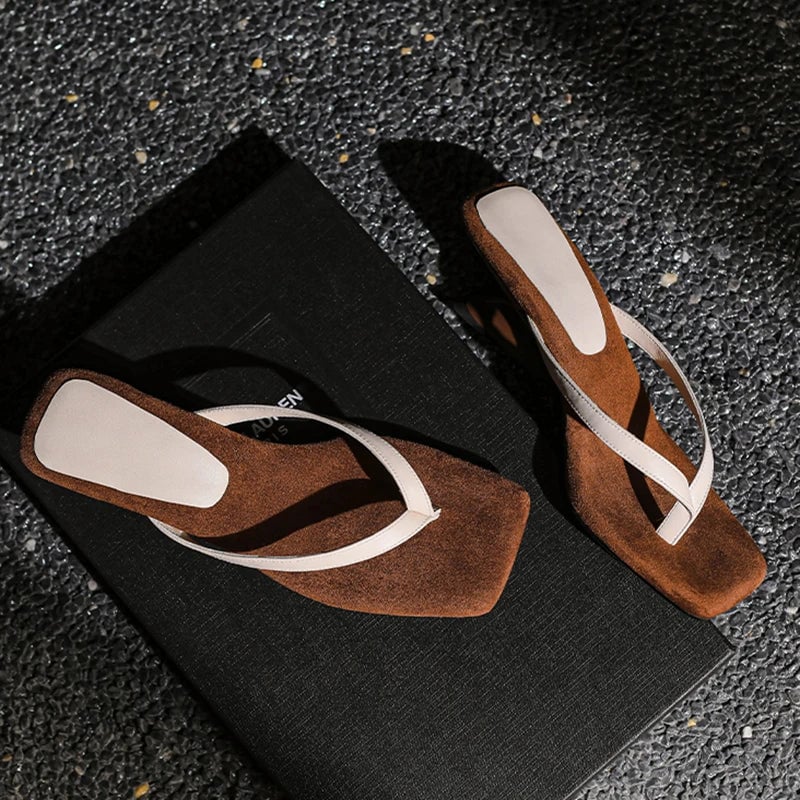 Georgette wedge sandal in black shown from the front, highlighting secure toe and ankle straps