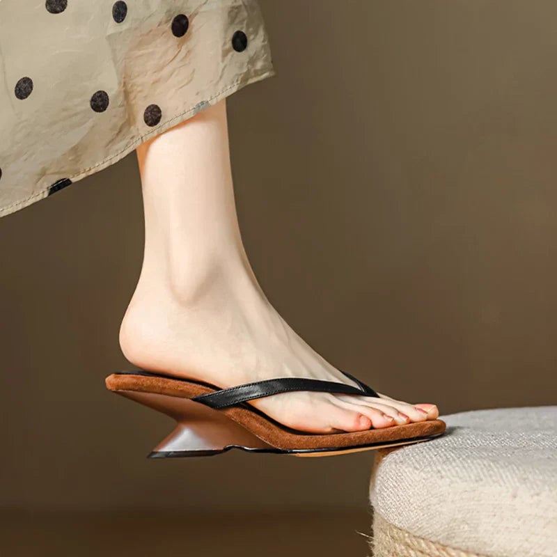 Rear view of the Georgette women's wedge sandal in black showing heel height and strap closure