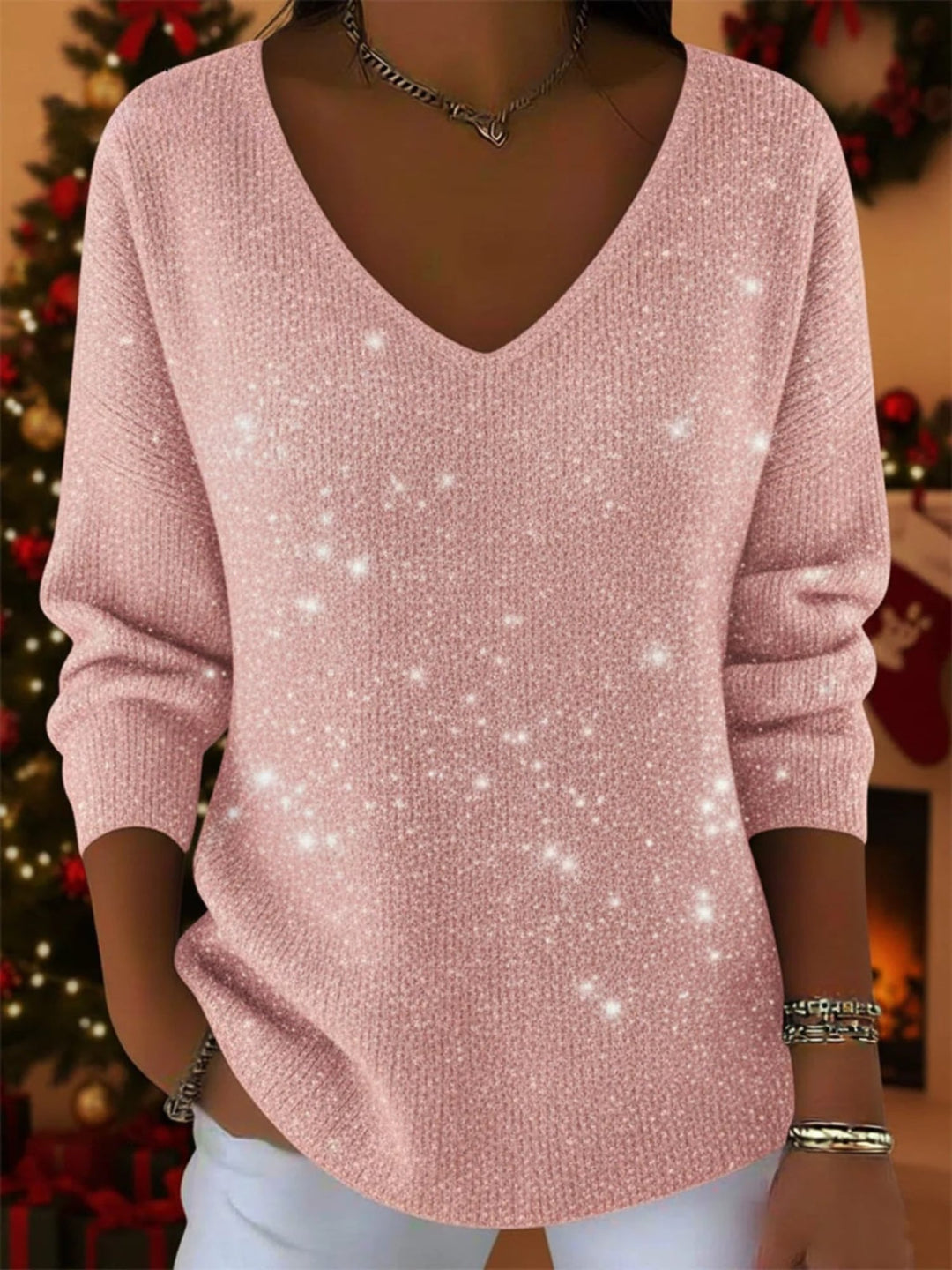 Georgia festive jumper in pink displayed on a model, paired with a casual skirt for a cheerful outfit