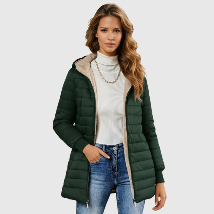 Side view of the Geraldine winter coat showing its structured silhouette and cold-blocking closure