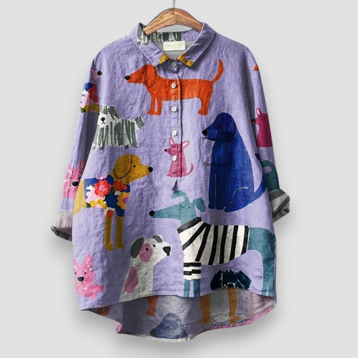Woman wearing a white relaxed-fit shirt with an all-over dog print, styled casually