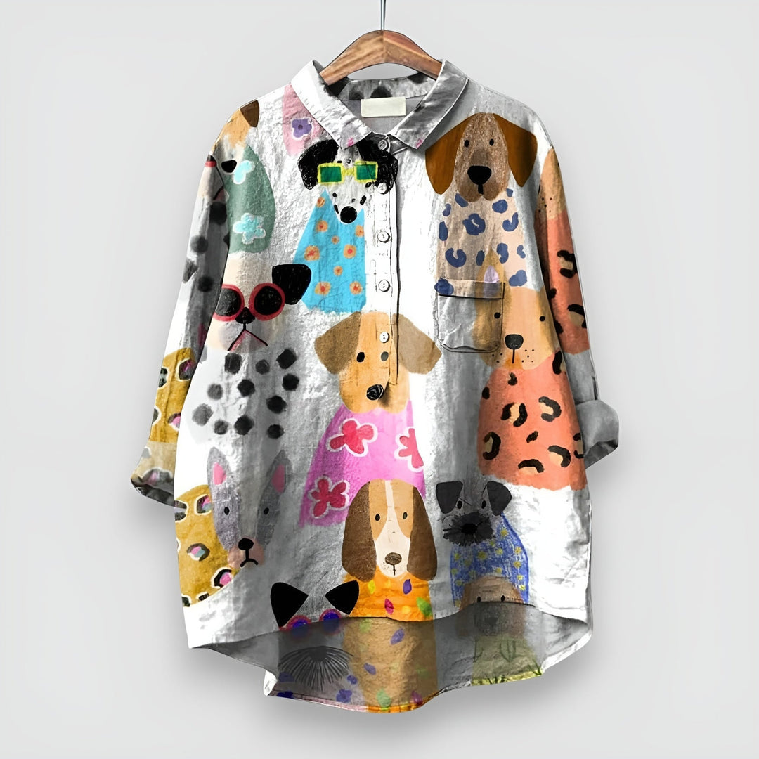Close-up of the whimsical dog print detail on a women's relaxed-fit shirt in white