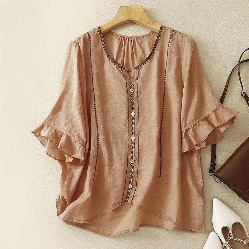 Flat lay of the pattern ruffle sleeve blouse in brown showing embroidery and button front detail
