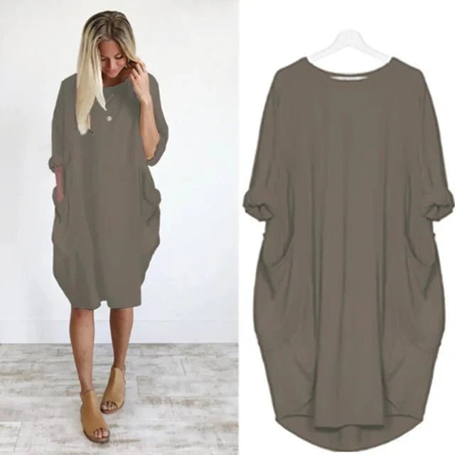 Model posing in the Gina elegant pocket dress highlighting the flattering body-skimming fit