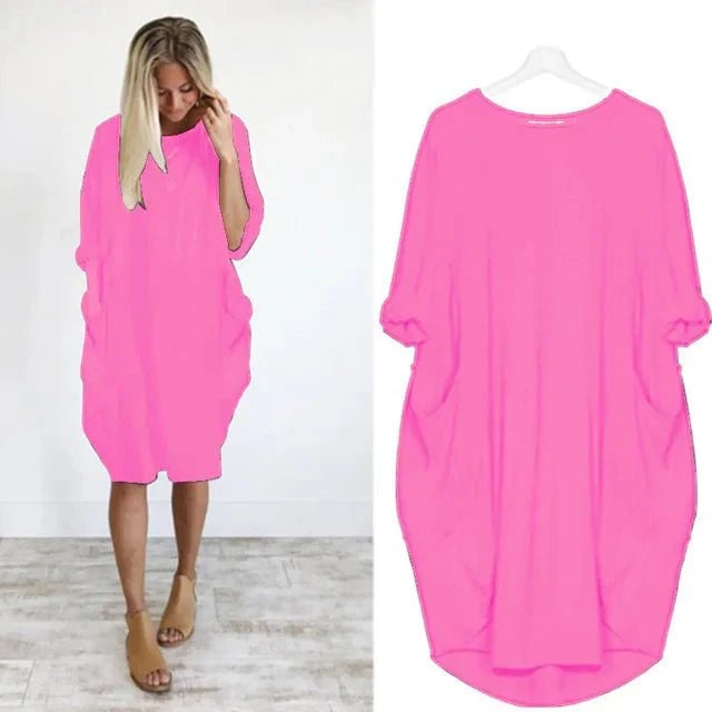 Full-length shot of the Gina dress worn outdoors in a garden setting