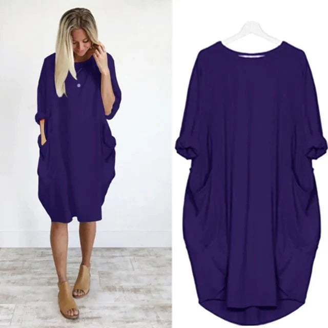 Close-up of the Gina dress neckline and draping detail