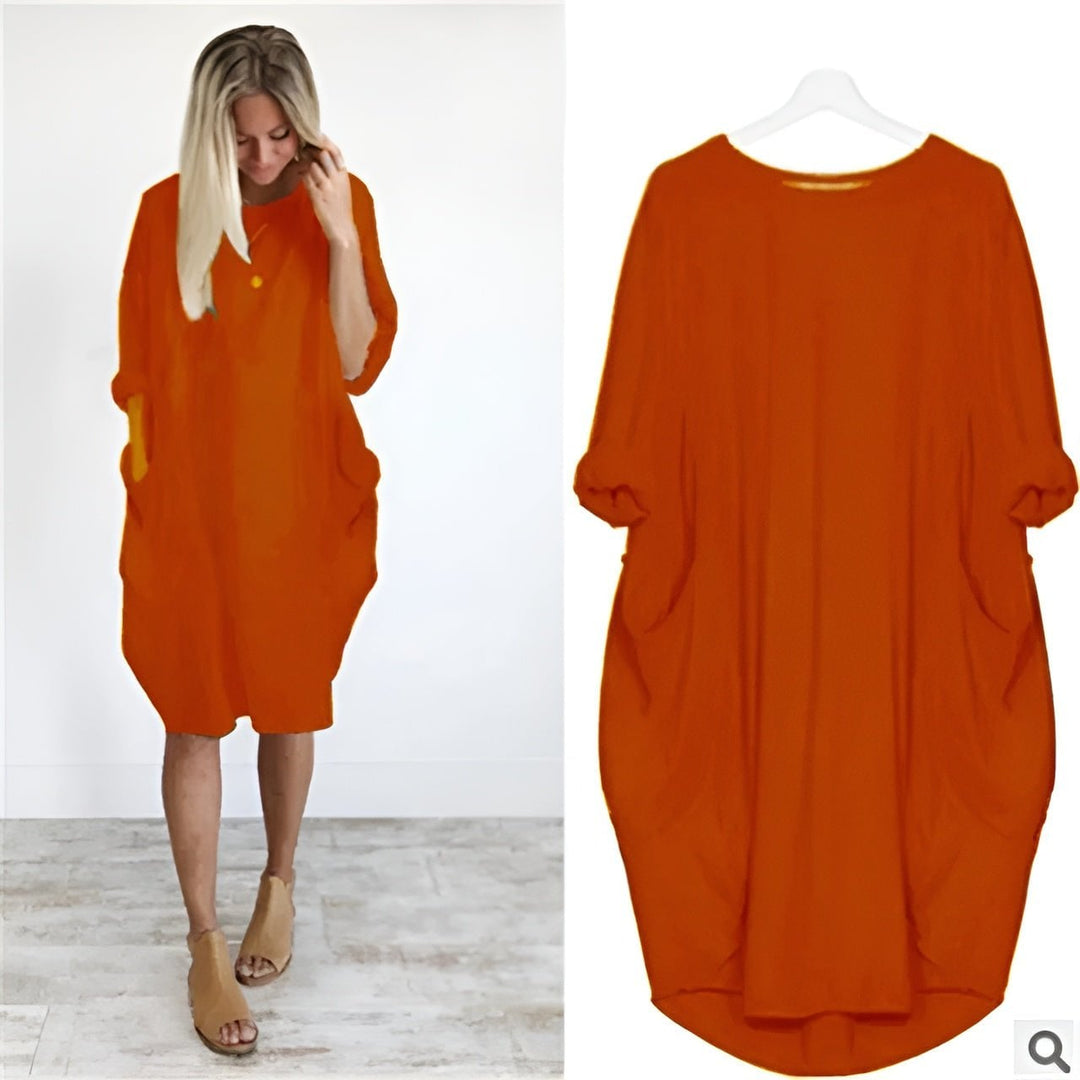 Model in the Gina elegant pocket dress demonstrating the ease of movement from the flowing cut