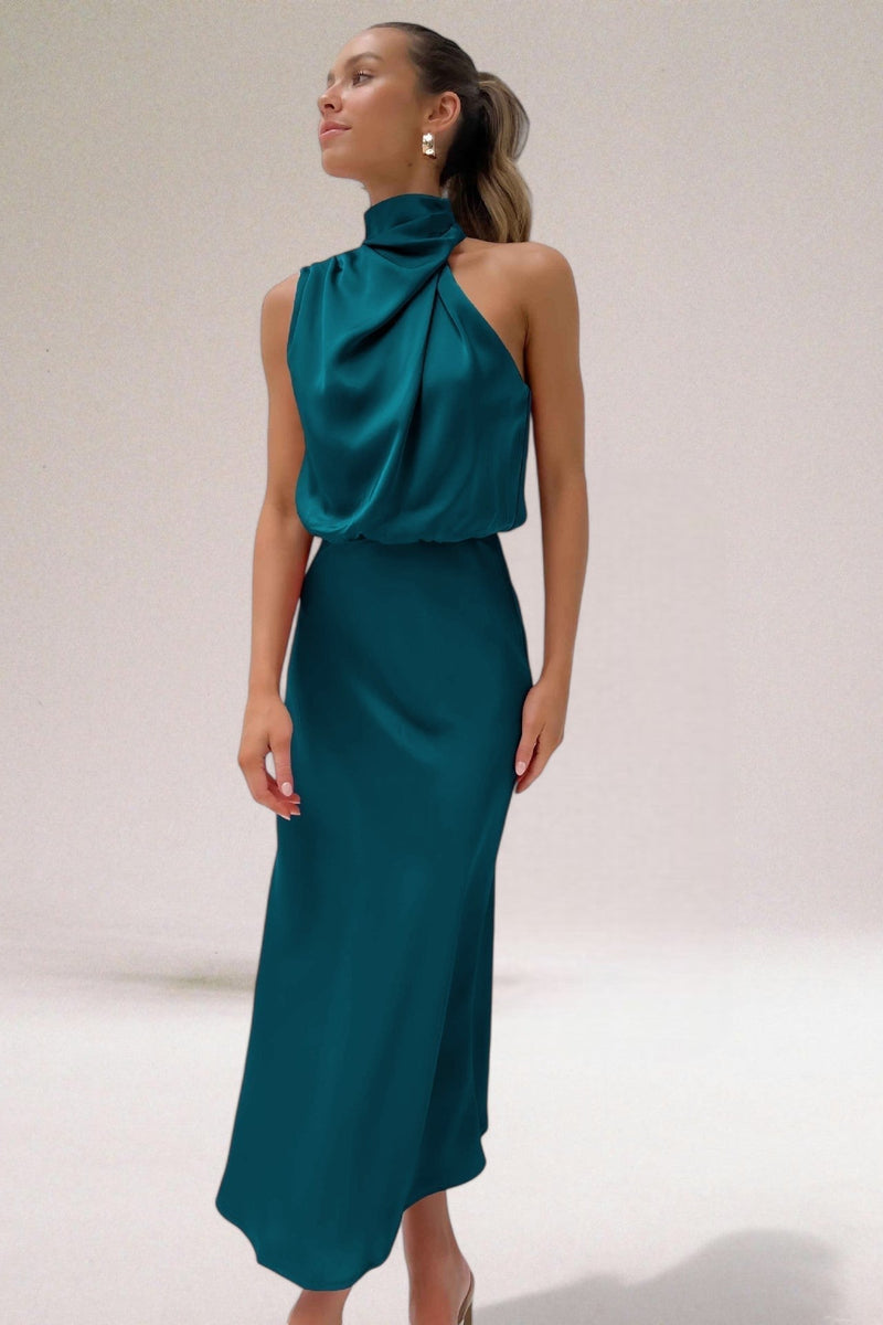 Close-up of the halter neck detail and draping fabric on an elegant occasion dress