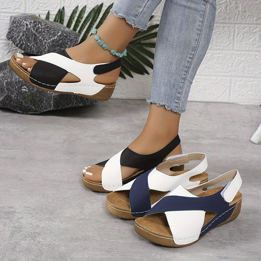 Giselle women's adjustable sandals in black, top-down view on neutral background