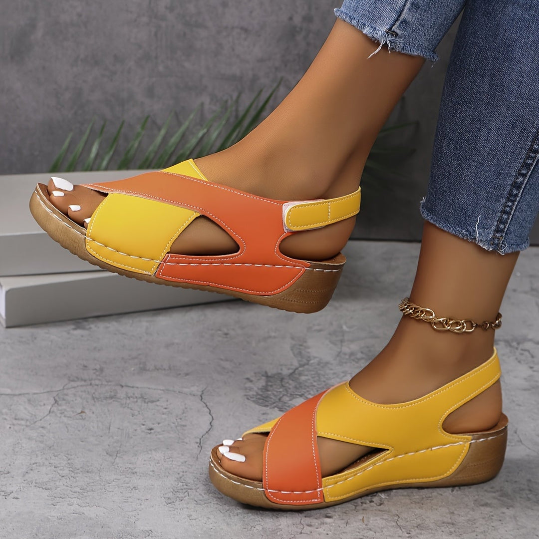 Giselle women's adjustable sandals in orange, top view showing cushioned footbed