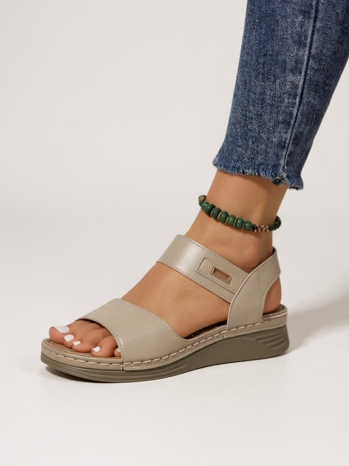 Giselle slip-on sandals in black, top-down view showing cushioned footbed