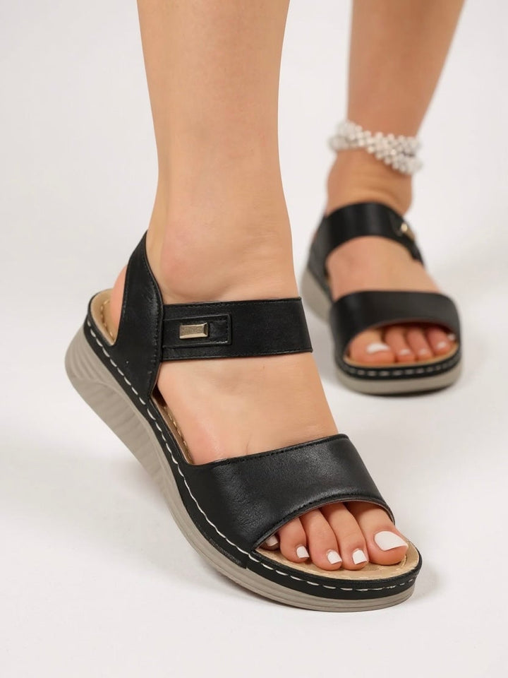 Giselle sandals in beige, angled front view on a clean white background