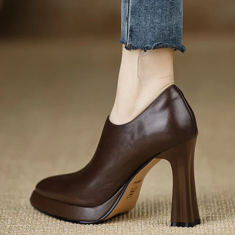 Close-up of the side zipper closure on the Giselle platform pump in black