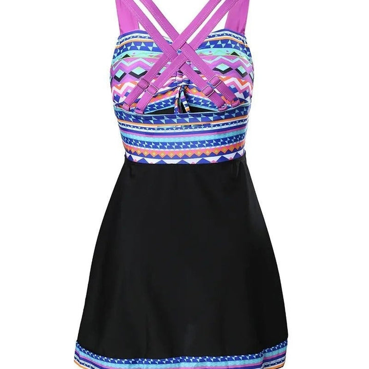 Full-length view of the chic patterned swim dress showing its flattering silhouette and built-in shorts