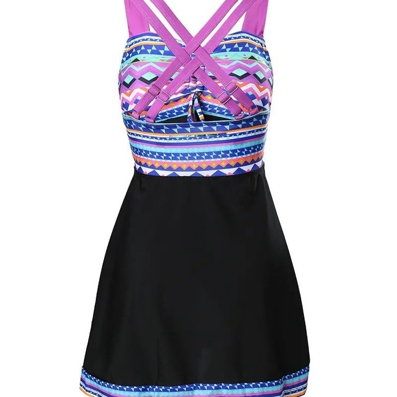 Full-length view of the chic patterned swim dress showing its flattering silhouette and built-in shorts