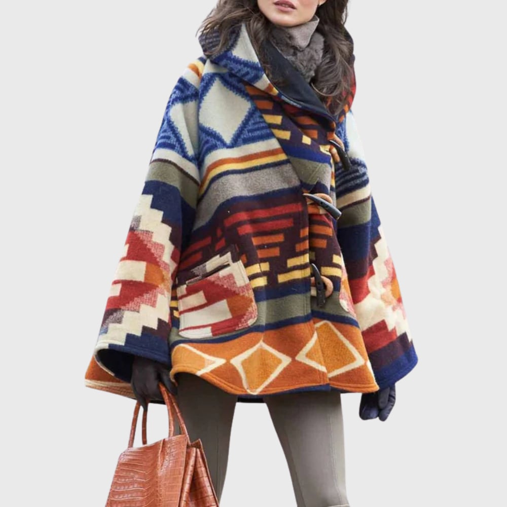 Woman wearing the Glena warm coat in a flattering tailored silhouette, styled for a polished everyday look