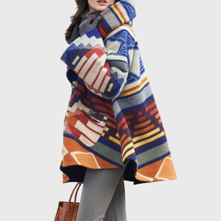 Full-length view of the Glena warm coat layered over a casual outfit, showcasing its versatile cozy style
