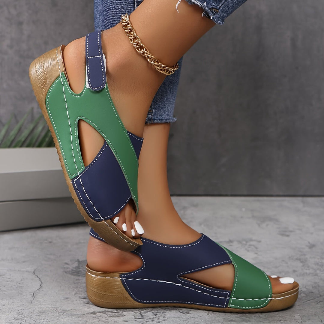 Side profile of Gloria sandal showing lightweight leather construction and minimal silhouette