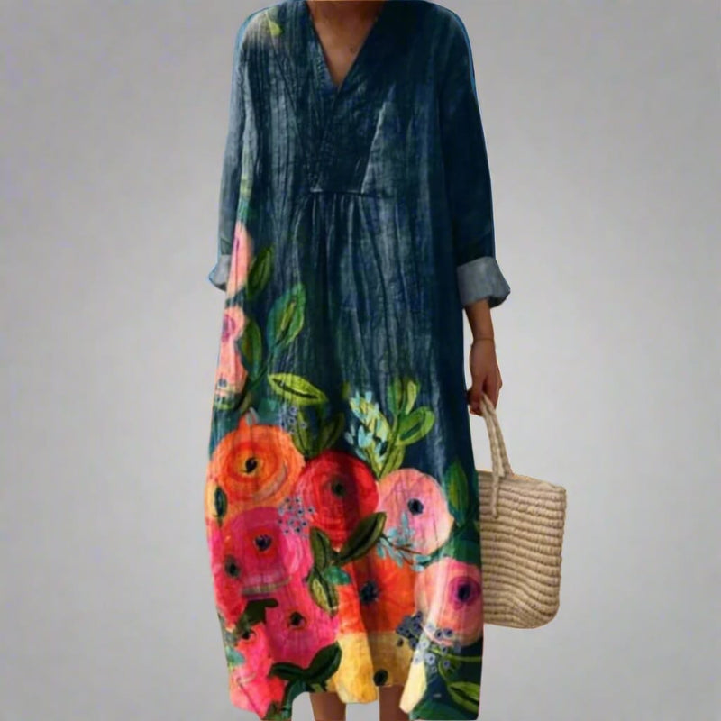Woman wearing the Gloria elegant geometric dress featuring a bold dream-inspired pattern and fluid flattering silhouette