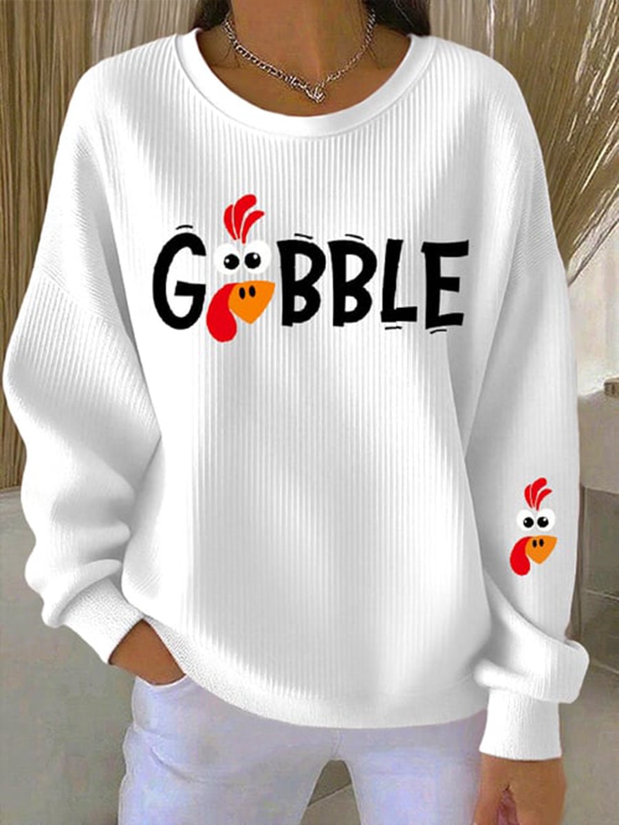 Close-up of the Gobble Season sweatshirt showing the holiday graphic print detail