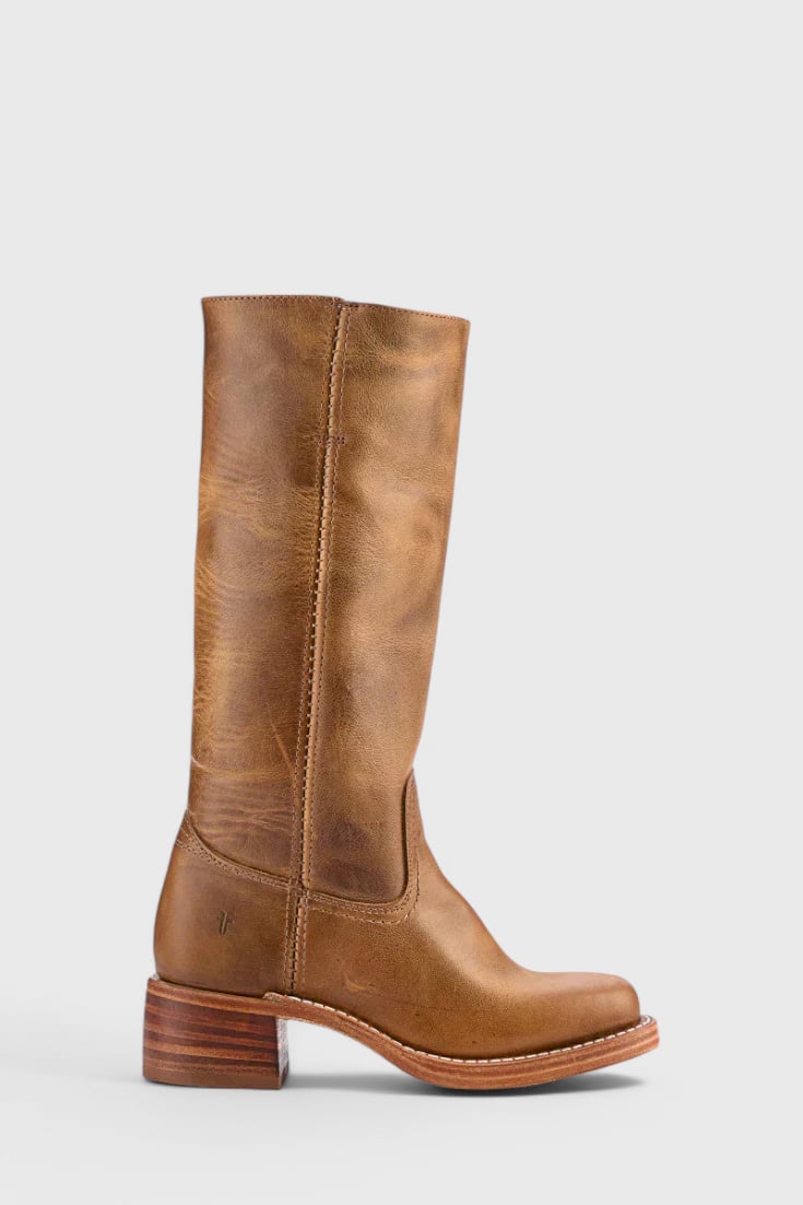 Grace modern classic boots in black shown in a flat lay with denim