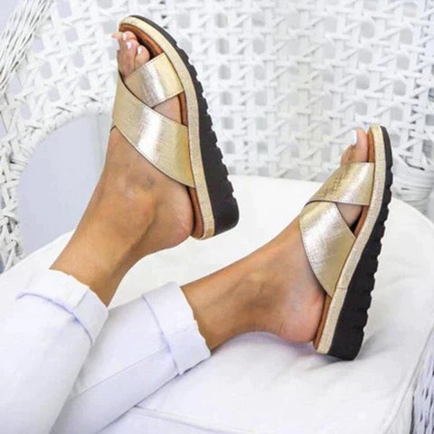 Woman wearing Grace silver orthopedic sandals while walking outdoors