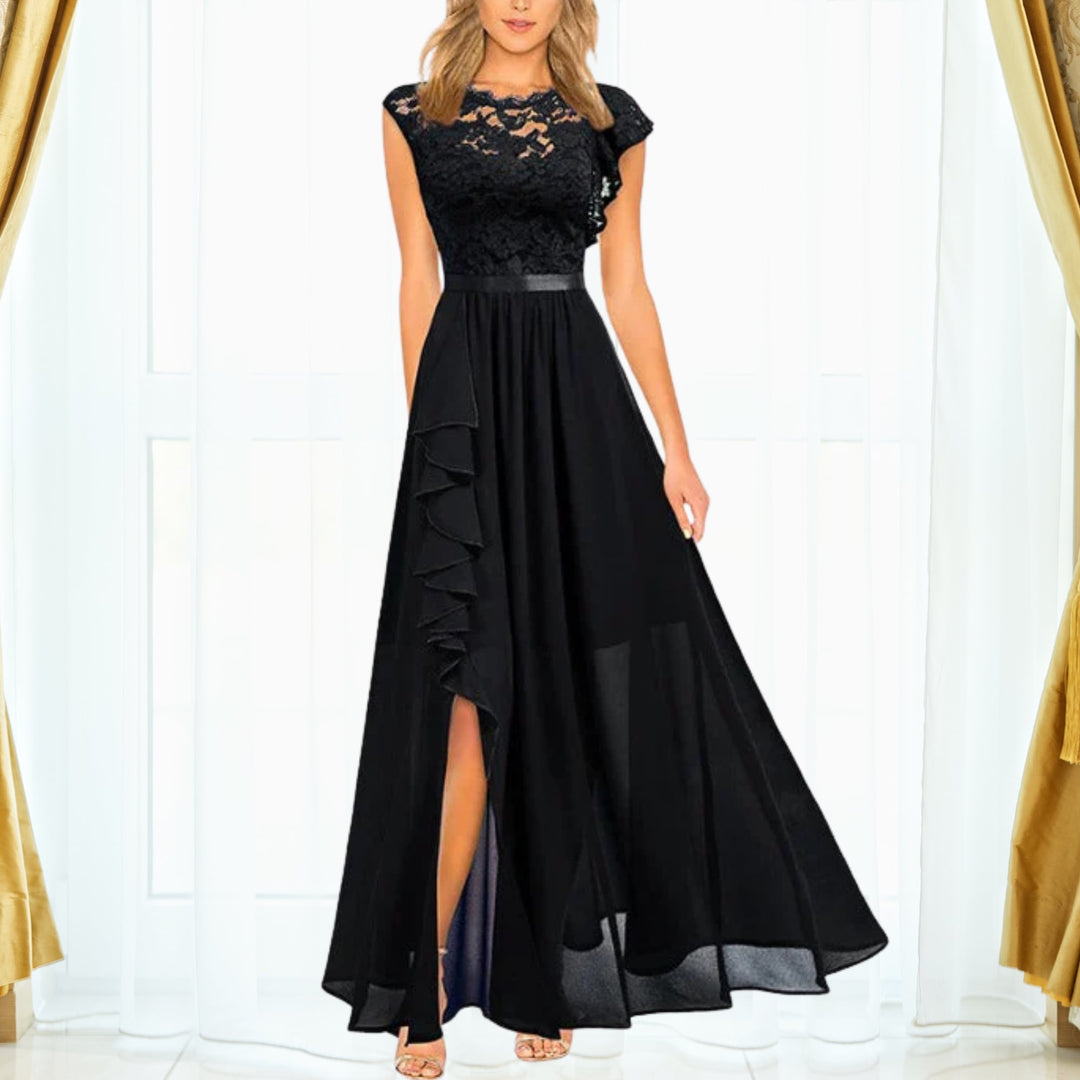 Woman wearing the Grace floral lace chiffon maxi dress with ruffle thigh-high split in black, shown full length