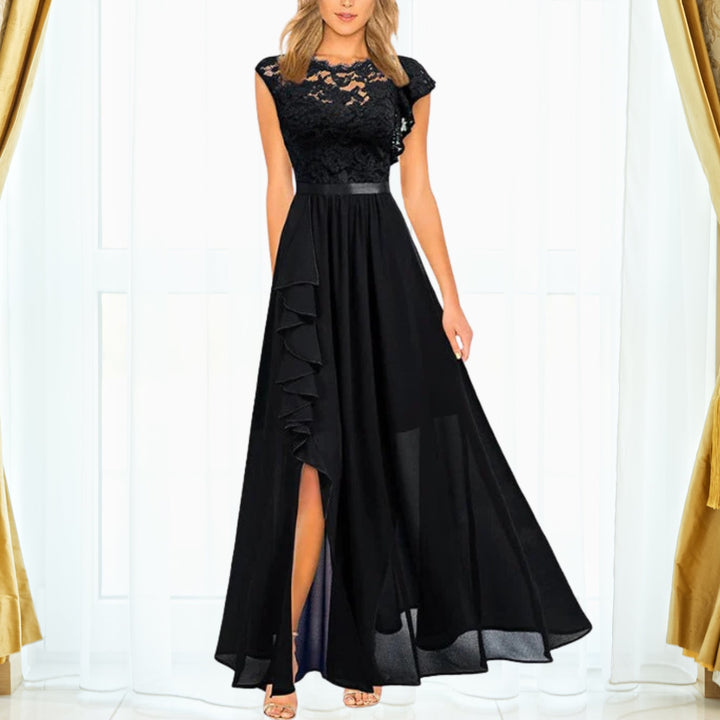 Woman wearing the Grace floral lace chiffon maxi dress with ruffle thigh-high split in black, shown full length