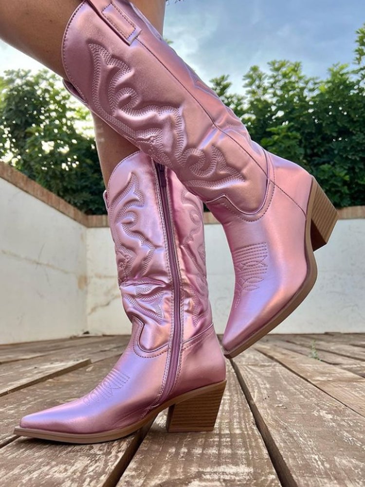 Black metallic cowboy boots shown from a three-quarter angle on white background