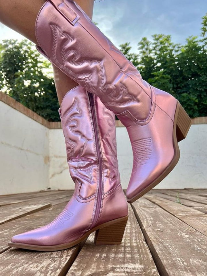 Black metallic cowboy boots shown from a three-quarter angle on white background