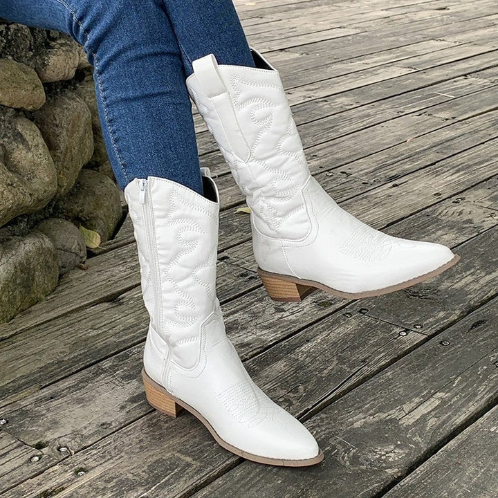 Women's metallic cowboy boots in silver, back view highlighting heel and shaft height