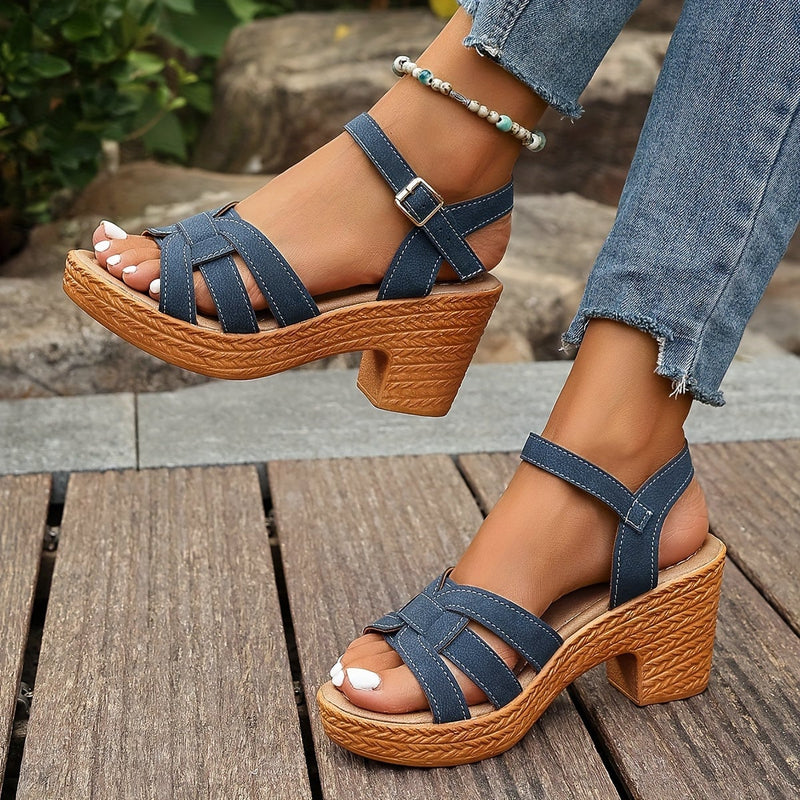 Greta wedge sandals in black with secure straps and cushioned insole, front view