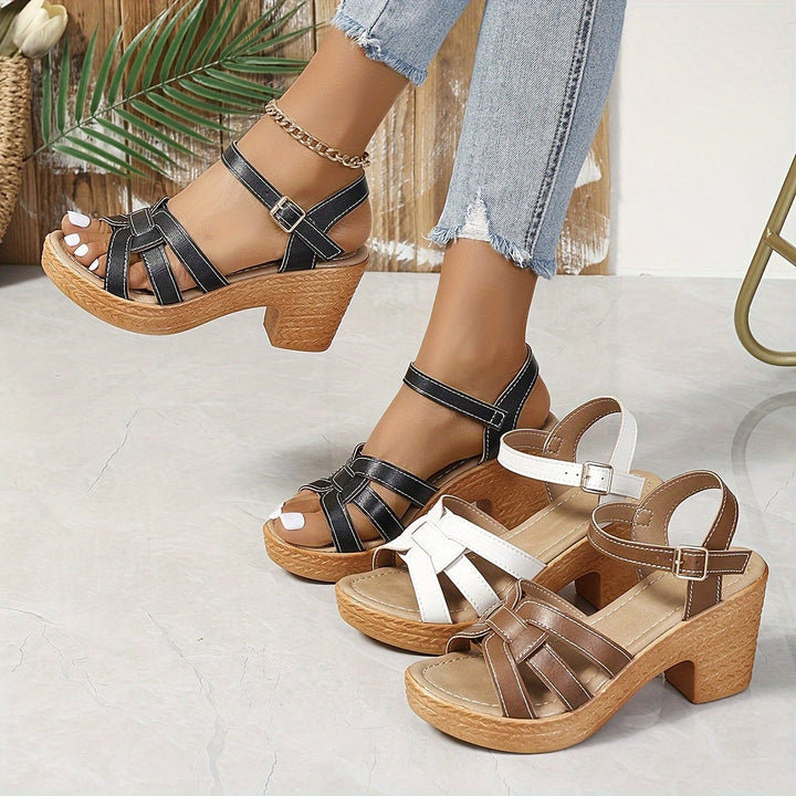 Greta wedge sandals in black, rear view highlighting strap detail